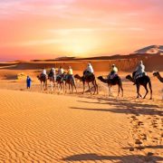 Camel trek through the golden dunes of Erg Chebbi with luxury
