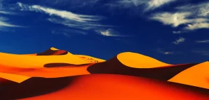 Dunas vermelhas sob um céu azul intenso – Roteiro de 4 Dias no Marrocos com Deserto a Partir de Fez