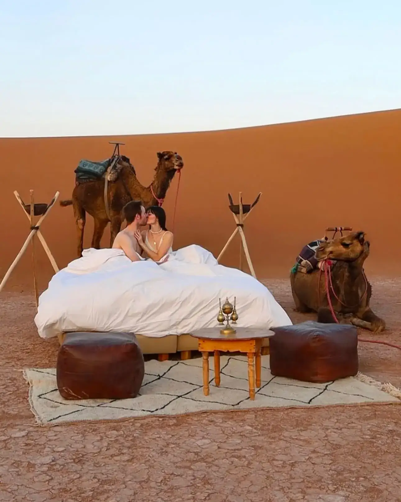 Luxury desert camp lit up at night on a private Morocco tour
