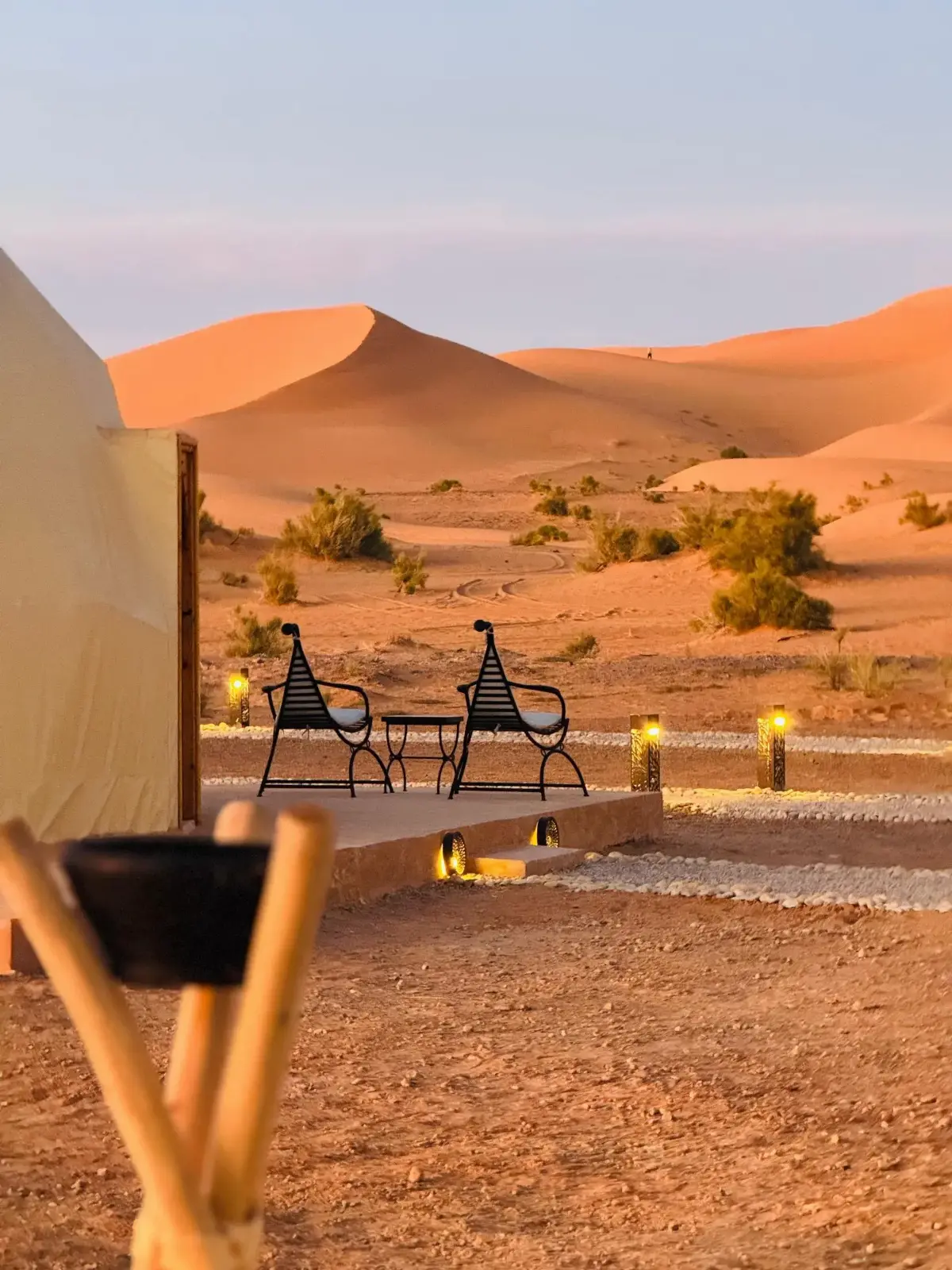 Luxury desert camp at dusk in Merzouga with Traveling Morocco